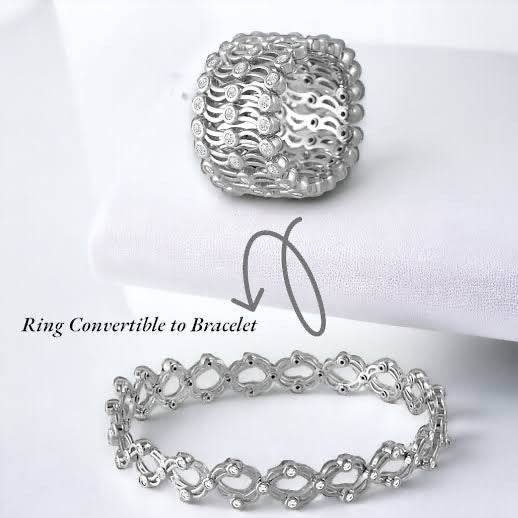 Silver ring convertible to bracelet on a white background